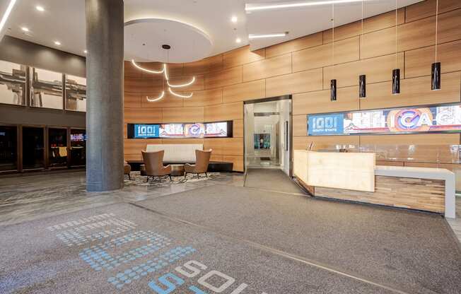 A lobby area with a large carpet that says "STOP" on it.