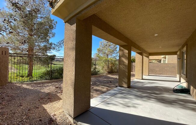 Stunning golf course view! Beautiful home is located on golf course inside Rhodes Ranch guard gated community! Master bedroom is downstairs!