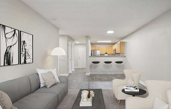 Model Living Room with Carpet and View of Kitchen at Retreat at Stonecrest Apartments located in Lithonia, GA.