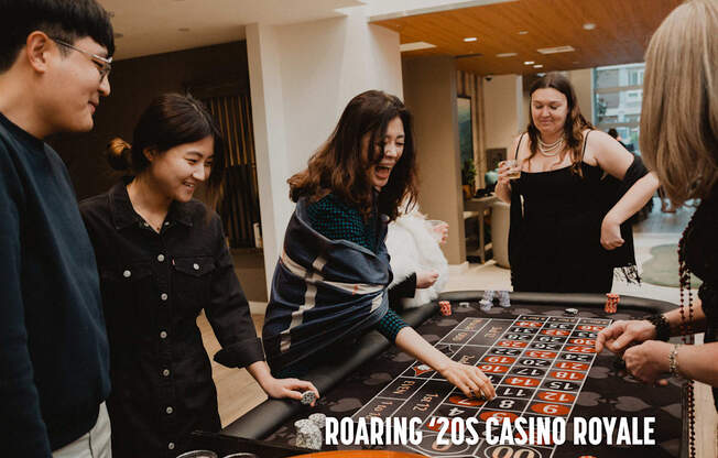 A group of people playing a game of roulette.