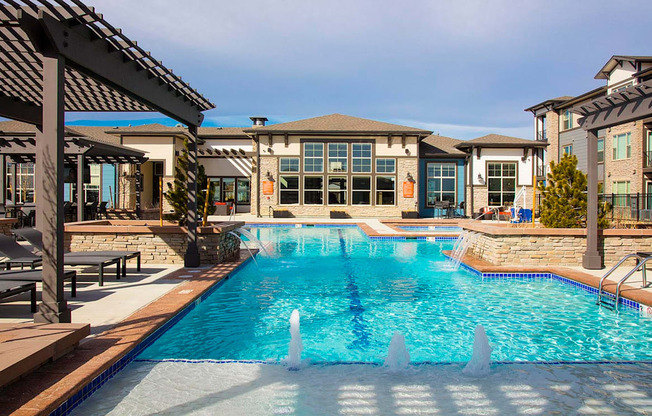 Outdoor Swimming Pool with Splash Jets and Pergolas