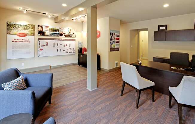 a living room and dining room with a table and chairs