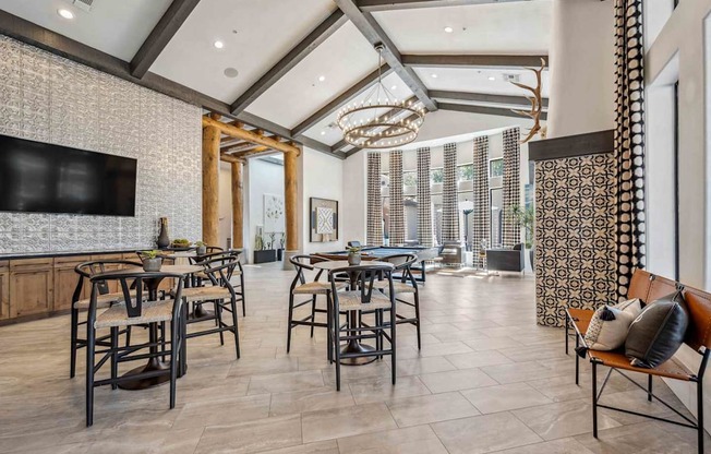 A modern dining room with a large table and chairs. at Lazo Apartment Homes, Arizona