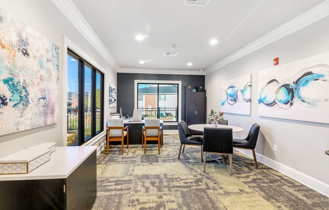 a dining room with a table and chairs and a large window at Crossgates Apartment Homes, Mississippi 39759