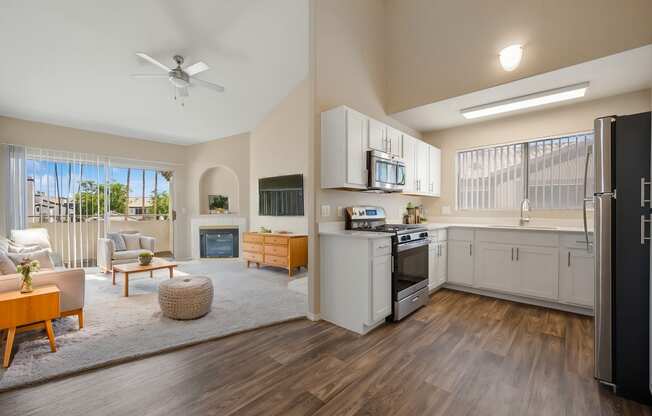 a spacious living room with a kitchen and a living room