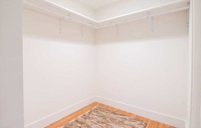 A room with a rug on the floor and a white wall at Woodley Sara Apartment, Van Nuys, CA