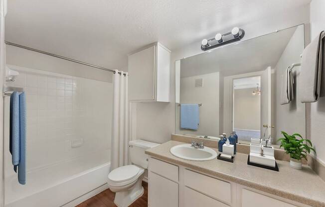 Bathroom with a toilet and sink at Great Hills, Austin Texas