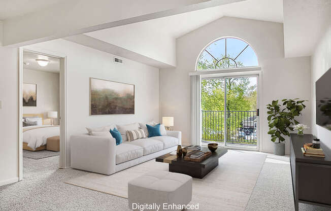 A living room with a cathedral ceiling at The Highlands Apartments in Elkhart, IN