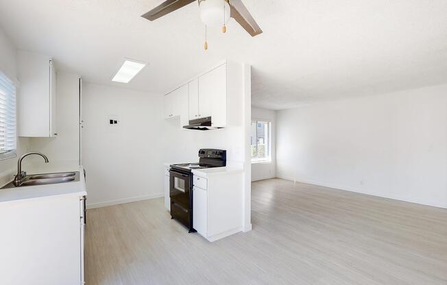 a room with a sink and a refrigerator