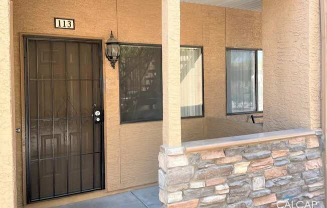 the front door of a building with a black door