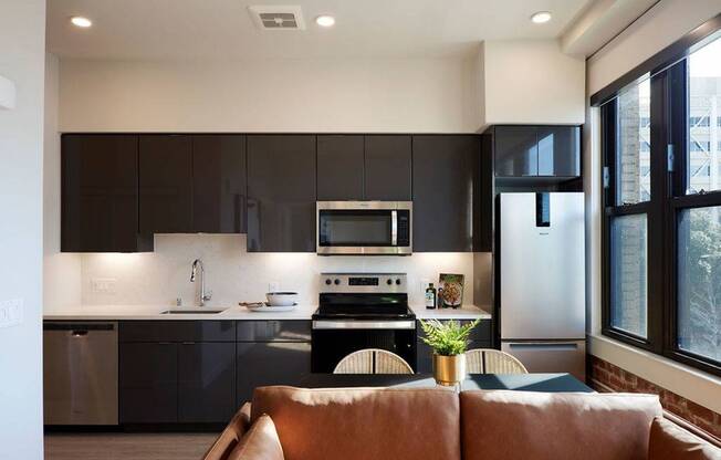 Thoughtful touches like undercabinet lighting, high gloss cabinets, oversized windows and roller shades combine to create an excellent living experience at Modera Berkeley.*