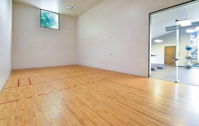 an empty room with a racquetball court  at Riverset Apartments, Tennessee
