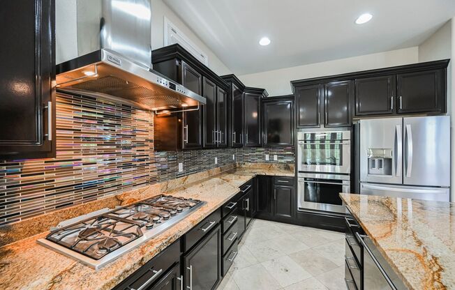 This Exquisite, 4 Bedroom Single Story Home Is Located In The Highly Desirable Red Rock Community.