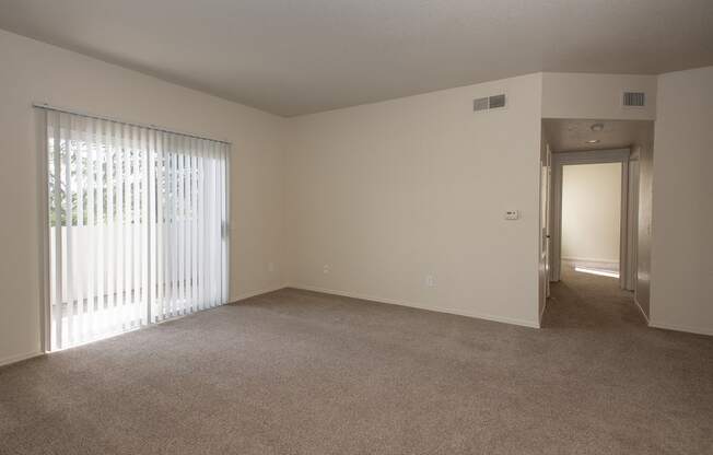 Sunset Summit vacant living room and patio sliding door