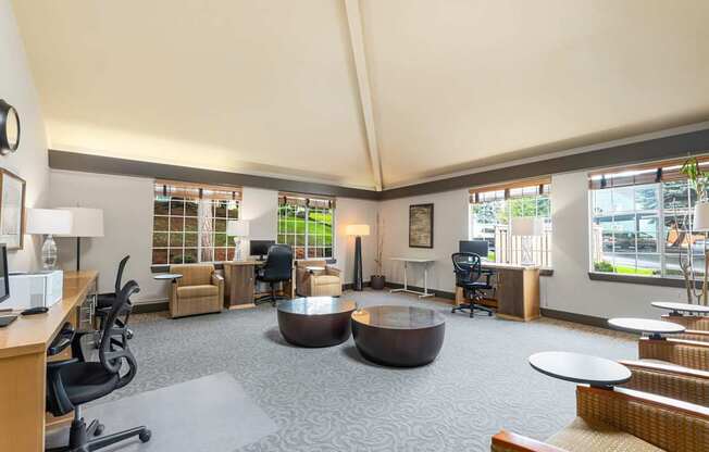 A conference room with a long table and chairs.