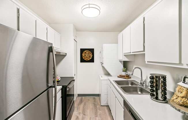 Modern Kitchen With Stainless Steel Appliances And Double Door Refrigerators at The Waverly, Belleville, Michigan
