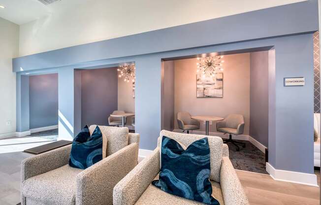 A living room with a couch and chairs.