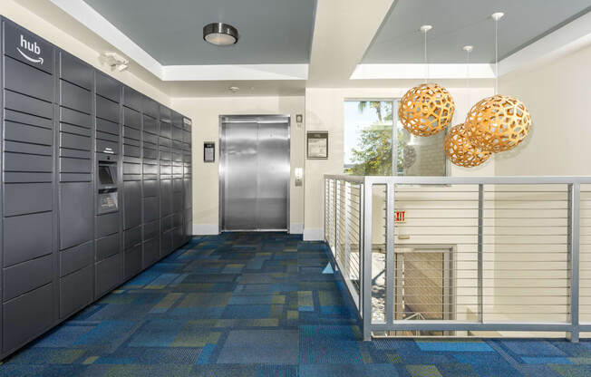 the lobby of a building with lockers and a fire place