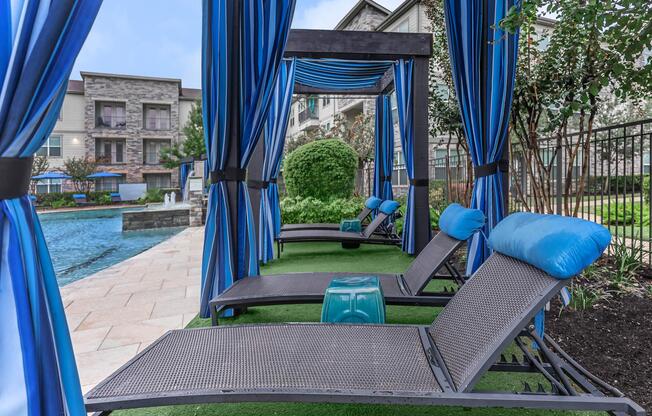 a couple of lawn chairs sitting on top of a blue chair