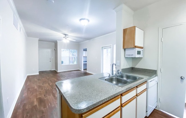 Built in microwave, dishwasher and private backyard at Tuscany Square Apartments in North Dallas, TX. Now leasing studios, 1 and 2 bedroom apartments.