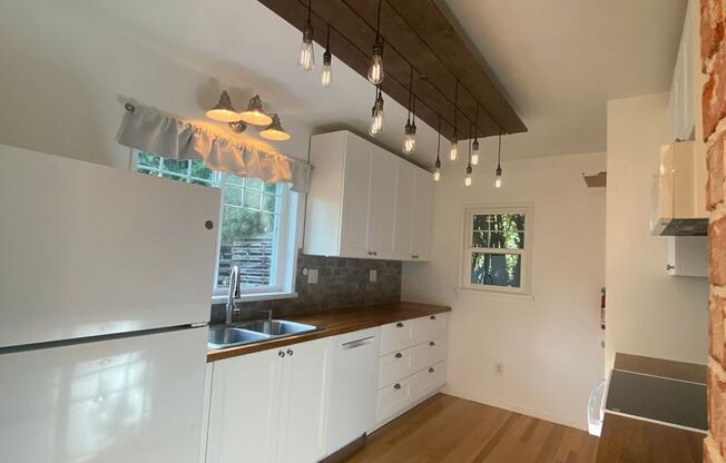 Perry District Gem – Move-In Ready 3 plus Bed / 2 Bath Brick Home with Finished Basement & 2-Car Garage