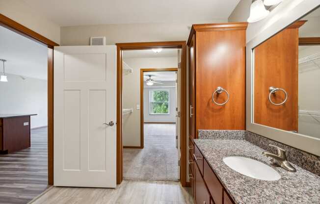 a bathroom with a sink and a mirror