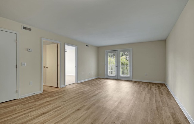 Living room, wood-like flooring, patio
