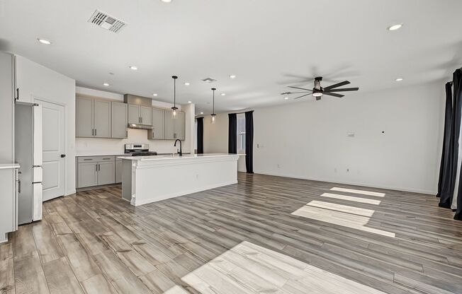 5-Bedroom Home for Rent in Gated Kyle Canyon Community | Downstairs Bedroom | Modern Kitchen