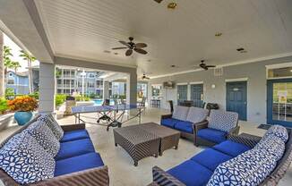 a living room with couches a table and a ping pong table  at Ocean Park, Jacksonville Beach