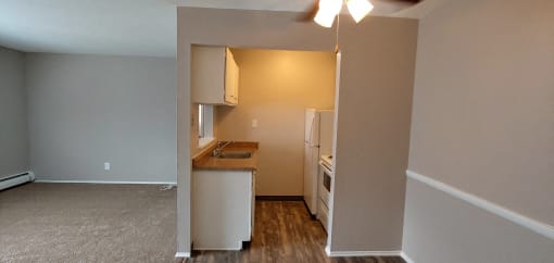 a view of a kitchen from the living room