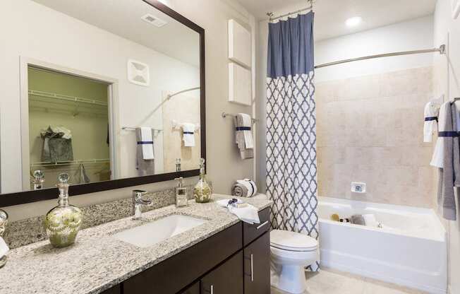 Master bath with tile and granite  at LandonHouse Apartments in Lake Nona, Orlando, FL 32827