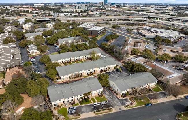 A bird's eye view of a residential area with houses and apartment buildings.