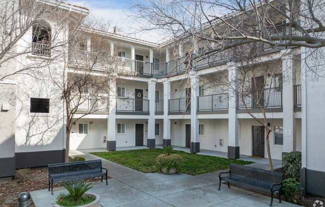 A large apartment complex with a courtyard and trees at Cornerstone at Gale Ranch Apartments, San Ramon, California