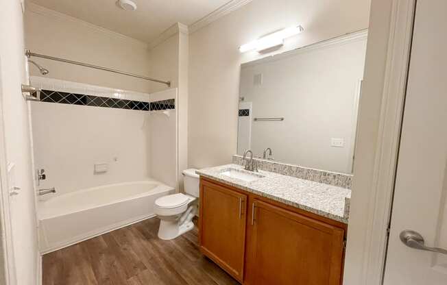 Bathroom with Wood Style Flooring and Soaking Tub located in Lawrenceville, GA