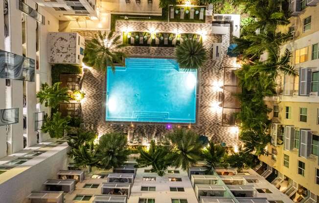 a hotel with a pool in the middle of a building