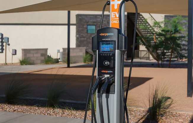 An electric vehicle charging station is installed in a parking lot.