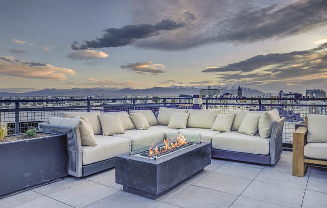 patio has a view of the city and the mountains in the background