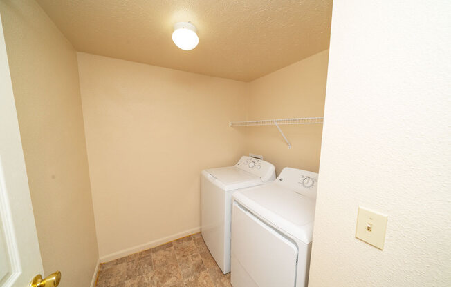 Separate Laundry Room at Trillium Pointe Apartment Homes in Jackson, MI