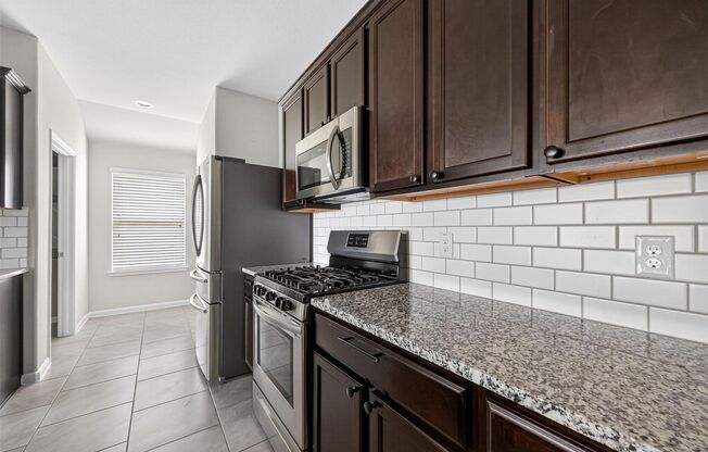 Located in the desirable Tamarron community, this well-maintained single-story home offers 4 bedrooms and 2 bathrooms with a bright, open-concept layout designed for both everyday living and entertaining. The kitchen showcases a large granite island, mode