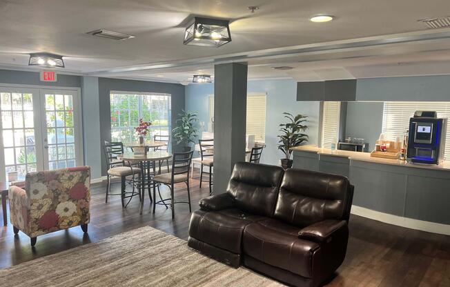 a living room filled with furniture and a large window