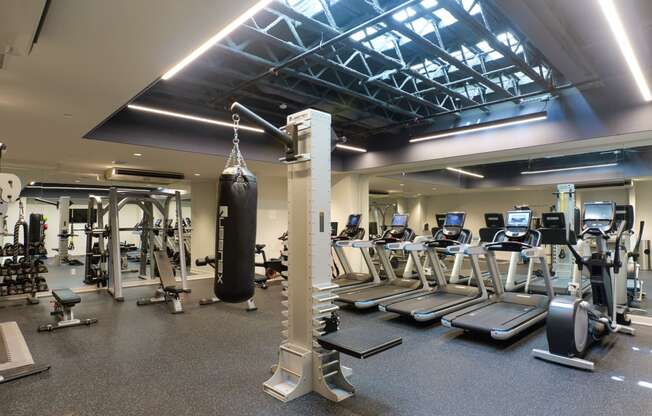 a gym with weights and cardio equipment and a punching bag at The Commonwealth Building, Pittsburgh, 15222