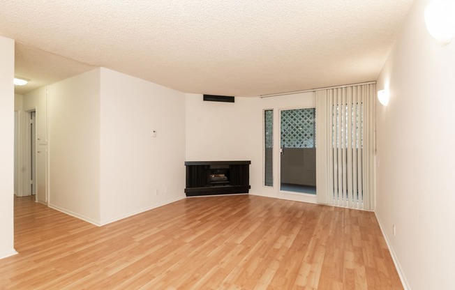 Living Room with Hardwood Floors, Fireplace and Patio Doors