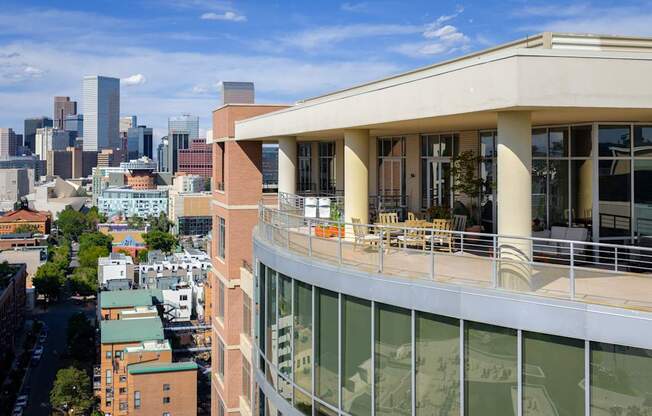 A view of a city from a high angle with a building in the foreground.