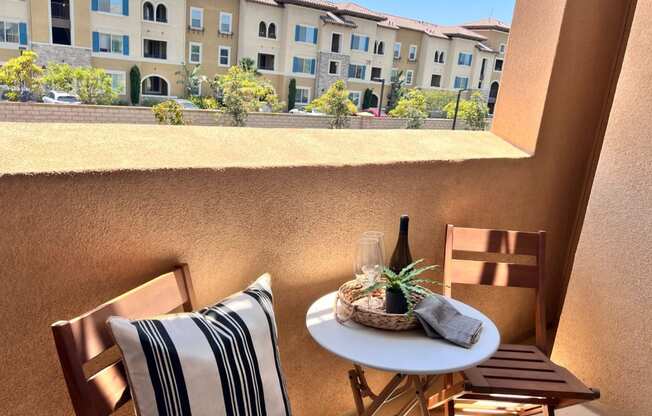 a patio with a table and chairs and a window