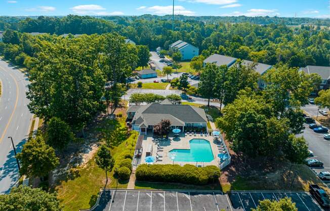 a birds eye view of the resort style pool and spa at the crossings apartments