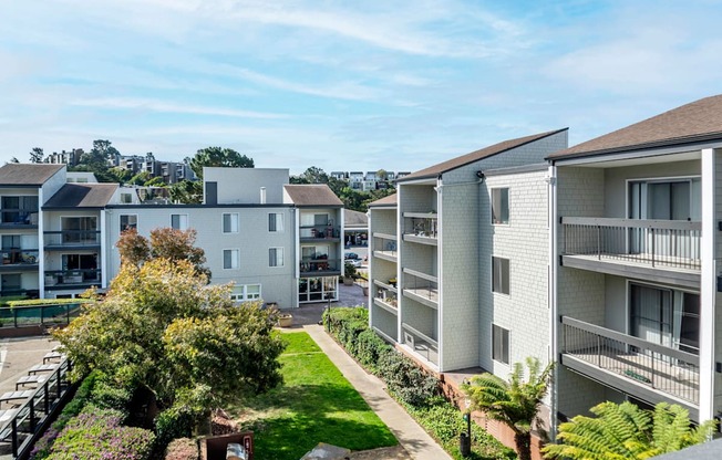 an aerial view of an apartment complex with a lawn and trees at Delphine on Diamond, San Francisco