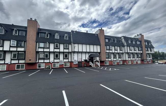 an empty parking lot in front of an apartment building at Kings Court, Alaska, 99501?