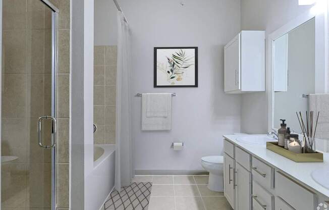 A bathroom with a white toilet, a white sink, and a white shower.