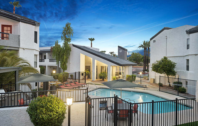 Aerial View of Community Swimming Pool and Pool Furniture at Crystal Creek Apartments located in Phoenix, AZ.