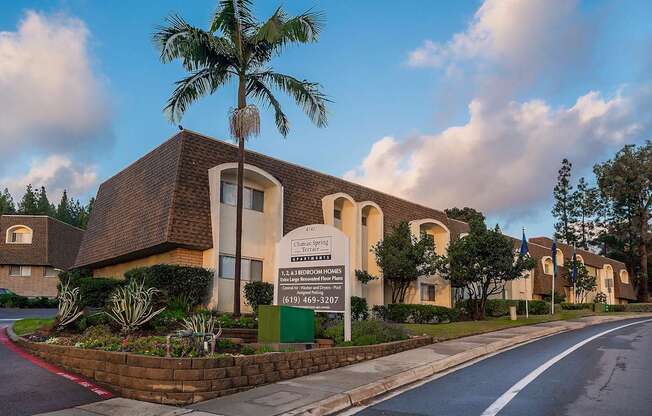 a building with a palm tree in front of it